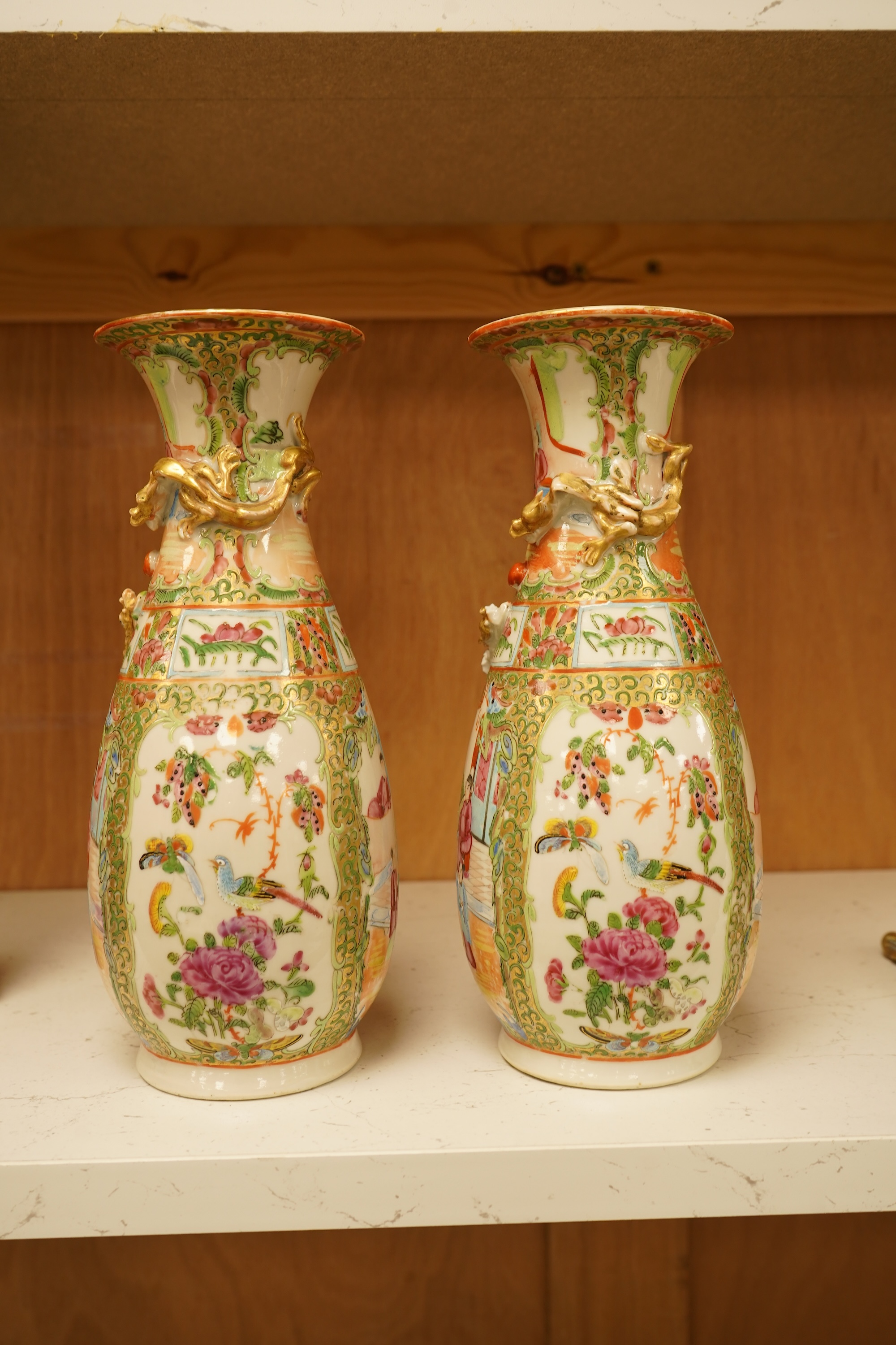 A pair of 19th century Chinese famille rose vases, 25cm